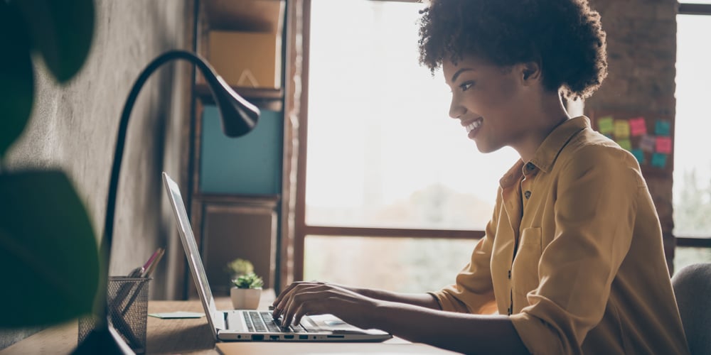 Woman working on laptop at home